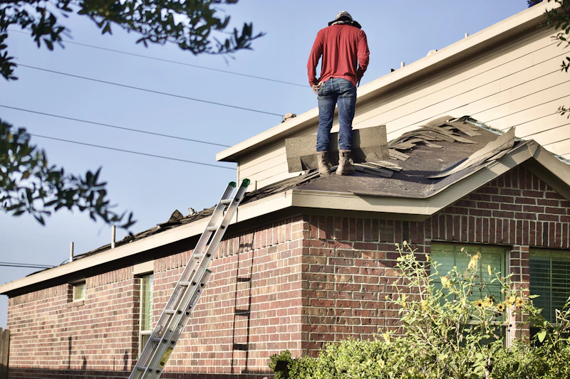 Roofing contractor inspecting roof installation